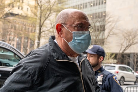 man wearing a blue surgical mask outside