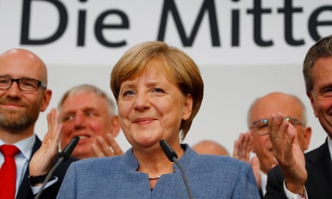 German Chancellor Angela Merkel reacts to first exit polls in the German general election in Berlin.
