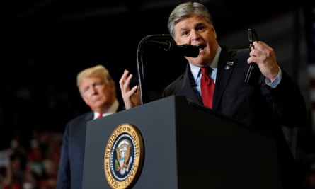 Former president Trump listens as Sean Hannity speaks at a campaign rally in Missouri in 2018. On 15 November, Hannity provided supportive coverage of Trump’s presidential bid.