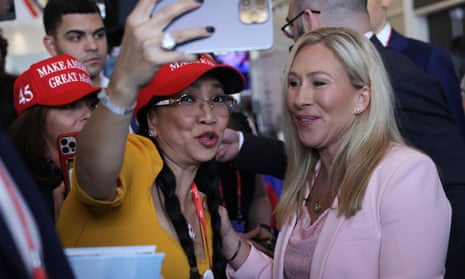 Marjorie Taylor Greene (R-GA) (R) greets an attendee during the annual Conservative Political Action Conference (CPAC), in Maryland.