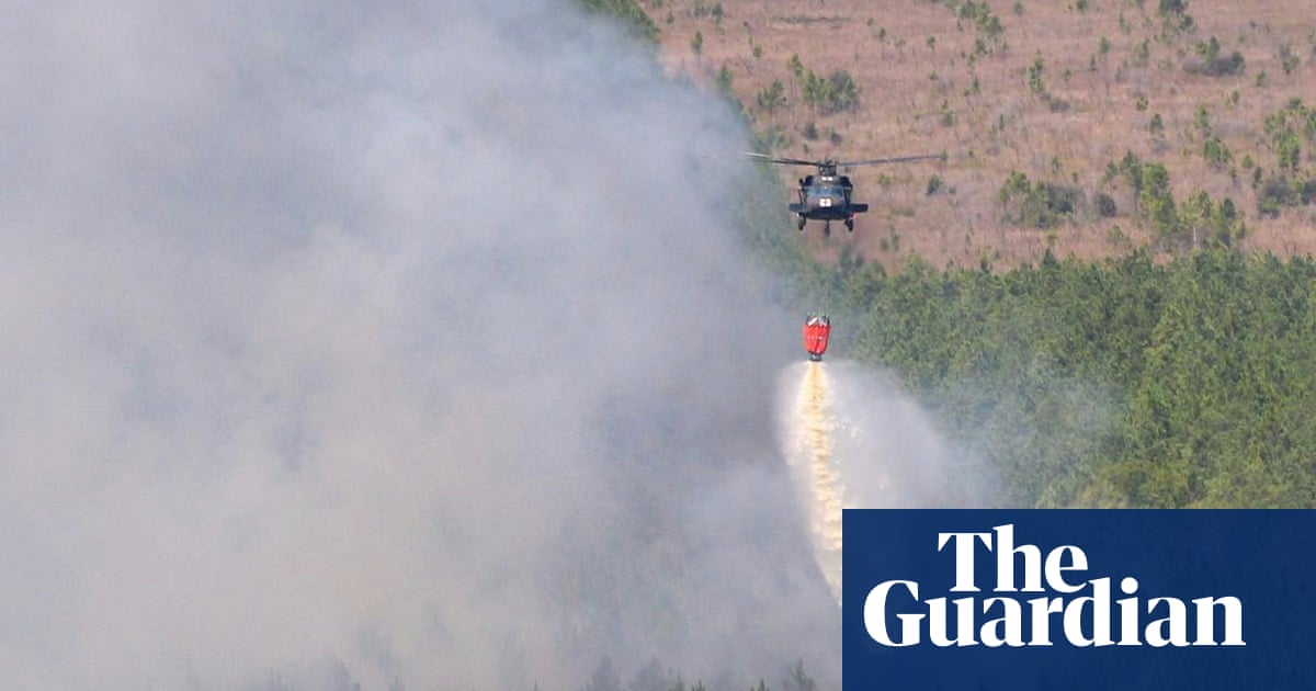 Louisiana residents told to ‘get out now’ in face of sweeping wildfire – The Guardian US