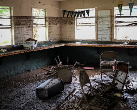 Chairs lie inside a damaged room following the flooding.