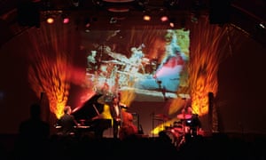 Musicians on a stage in an evening performance in the hotel’s concert hall.