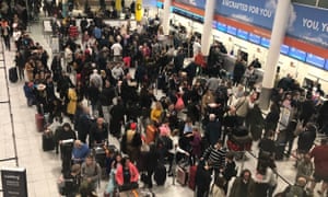Queues of passengers in the check in area at Gatwick Airport