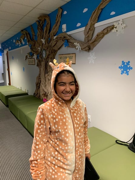 a girl in a reindeer onesie