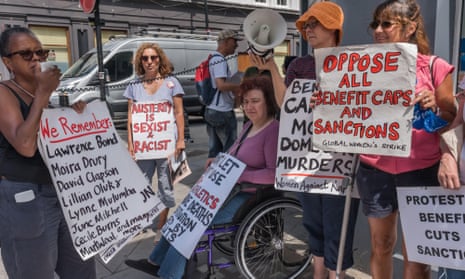 Women protest against benefit cuts outside Kentish Town jobcentre in London in July.
