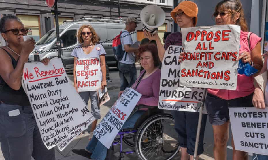 Women protest against benefit cuts outside Kentish Town jobcentre in London in July.