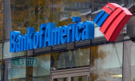 a blue bank of america sign and logo on a glass building