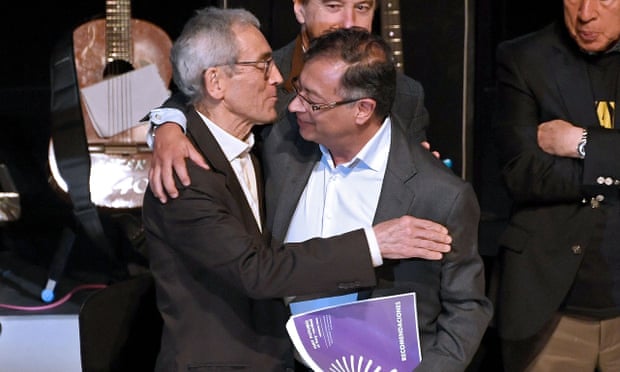 Colombia's president-elect Gustavo Petro (right) embraces the president of Colombia's truth commission, Francisco de Roux, during the presentation of their final report on the country’s decades-long armed conflict on Tuesday in Bogotá.