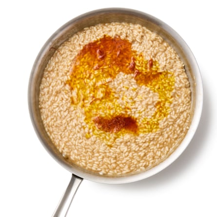 adding the saffron-infused stock