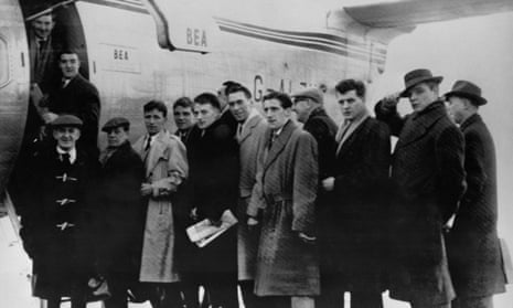 Don Davies (top left) with journalists, Manchester United staff and players, prepare to board the BEA Elizabethan plane in February 1958 in Manchester