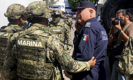 Troops from the Mexican navy escort Acapulco public security chief Max Lorenzo Sedano
