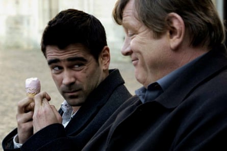 Farrell, holding an ice-cream cone in one hand and fingers crossed with the other, and Gleeson as Ray and Ken in In Bruges.