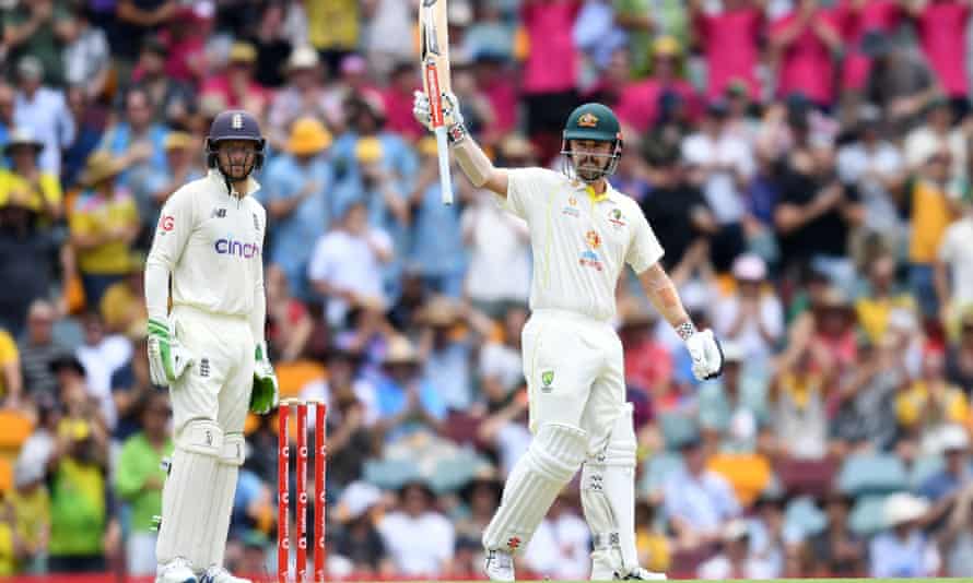 Travis Head raises his bat after reaching his 150.