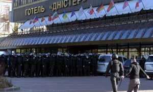 A rightwing militant faces police forces during the protest.