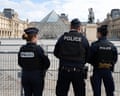 Police officers outside the Louvre after the heist