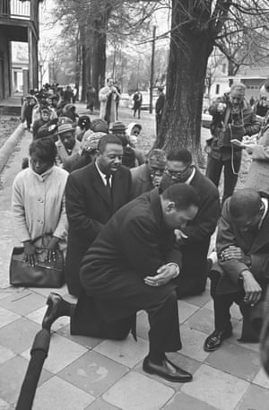 Taking a kneeMartin Luther King and other activists take a knee for a moment’s prayer before going to jail in Selma’ Alabama, 1965, after they were arrested on charges of parading without a permit. More than 250 were arrested as they marched to the Dallas County courthouse. Ivy League clothing was an intentional counterpoint to the revolutionary agenda and the dangers the civil rights activists faced every day. It’s this form of peaceful protest that would later inspire football quarterback Colin Keapernik.