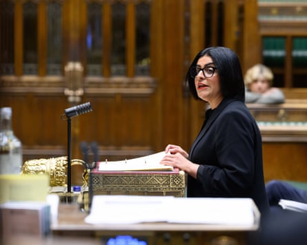 Shabana Mahmood making a statement to the House of Commons. She wears a black jacket and black-rimmed glasses and is speaking from a lectern