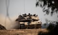 An Israeli tank moves near the border with the Gaza Strip on Thursday.