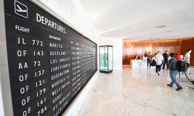 The departures board inside the Qantas first class lounge at Sydney airport