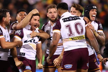 Ben Hunt gets mobbed after kicking the winning field goal in golden point.