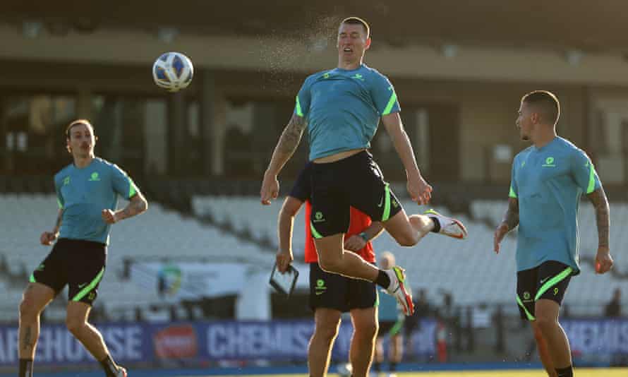 Mitch Duke heads a football during Socceroos training