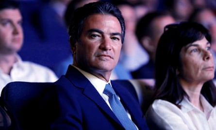 Yossi Cohen looking at the camera while sitting in an audience
