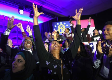 Supporters cheer as the election is called for Raphael Warnock, at his election night party in Atlanta.