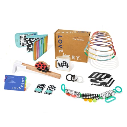 The Looker play set with box, fabric book, wooden toy, teething rings, cards and stroller toy