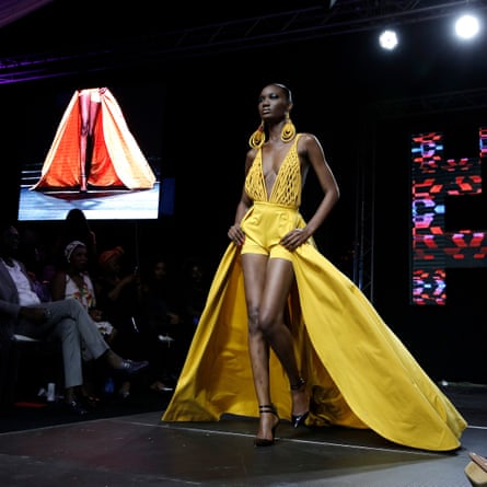 Model Nafissatou Gningue walks the runway at Dakar fashion week, July 2017