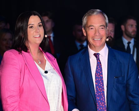Connolly in pink jacket next to Farage in jacket and tie