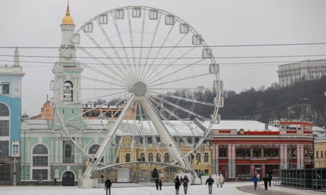People walk in a square in Kyiv as daily life continues amid the ongoing Russia-Ukraine war.