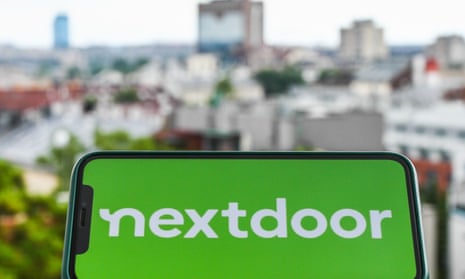 Nextdoor on a mobile phone with cityscape in the background