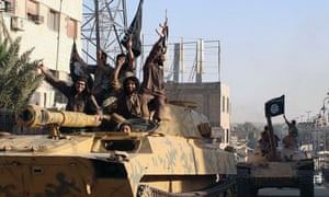 Islamic State fighters parading through Raqqa in Syria