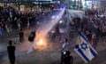 Israeli police use a water canon to disperse anti-government demonstrators in Tel Aviv on Saturday.