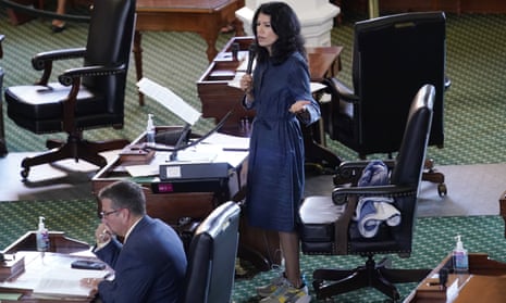 Carol Alvarado, a Texas state senator, wears running shoes as she filibusters a voting bill at the Texas capitol in Austin on Wednesday evening.