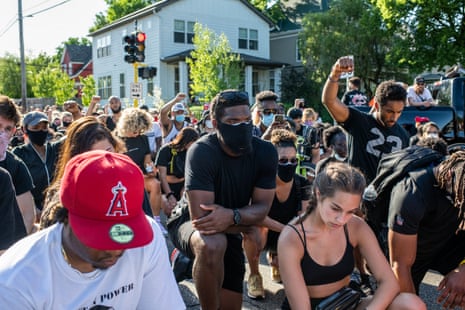 Demonstrators protest the death of George Floyd on June 5, 2020 in Minneapolis, Minnesota. Floyd died while in police custody on May 25, after former Minneapolis police officer Derek Chauvin kneeled on his neck for nearly nine minutes while detaining him. His death has sparked nationwide protests and rioting. 
