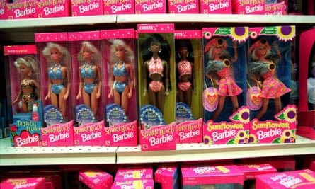Barbie dolls line the shelves at a toy shop