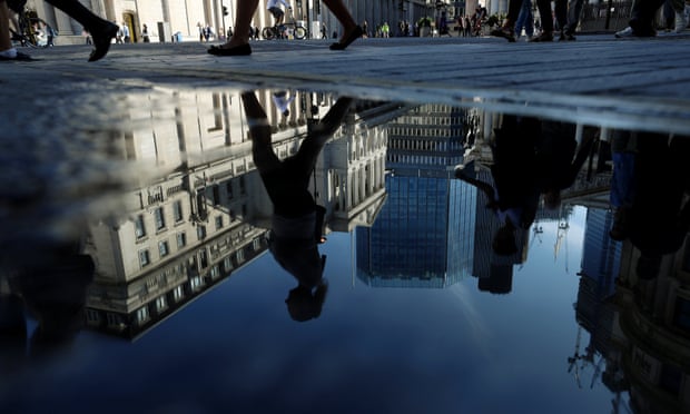 Bank of England reflected in puddle