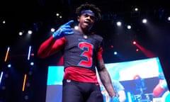 Texans wide receiver Tank Dell wears a new uniform during an uniform release party on Tuesday in Houston.