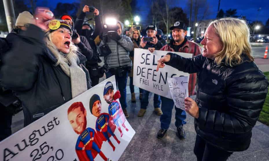 Demonstrators for and against Kyle Rittenhouse shout at each other outside the Kenosha county courthouse in Kenosha, Wisconsin Monday.