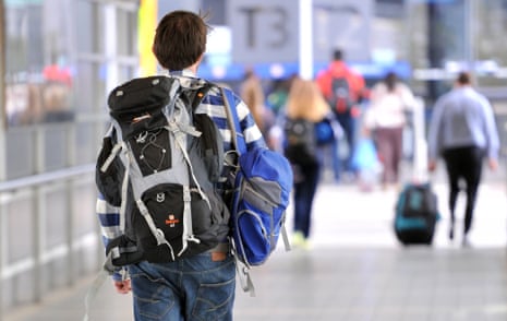 A backpacker makes his way to the international terminal at Melbourne airport.