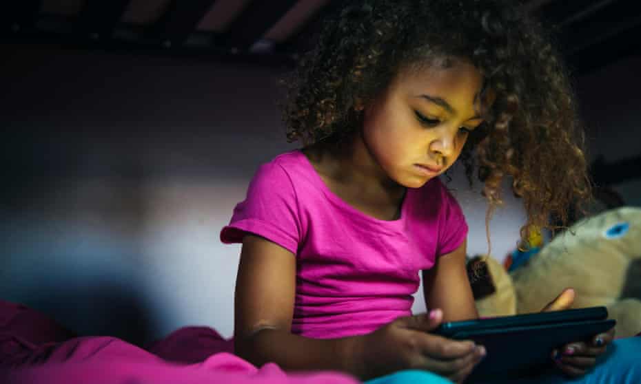 Young girl looking using a digital device