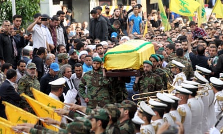 Hezbollah fighters carry the coffin of Mustafa Badreddine, a top commander killed fighting in Syria, during his funeral in Beirut in May 2016.