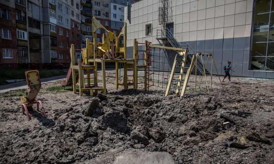 A local woman walks past a kids’ playground, damaged during shelling, as Russia’s attack on Ukraine continues, in the town of Lysychansk, Luhansk region, Ukraine on June 10, 2022.