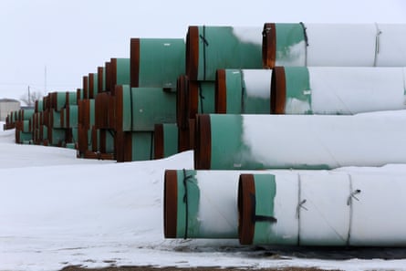 Pipes for the planned Keystone XL oil pipeline lie in the snow in Gascoyne, North Dakota, in 2017. Biden has ditched the project in a highly symbolic move.