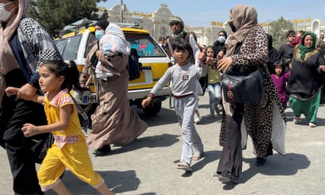 Women with their children trying to enter Kabul airport to leave Afghanistan in August.