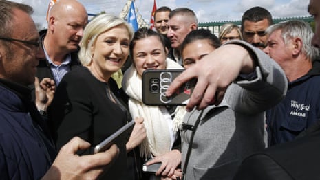 Le Pen takes selfies with factory workers 