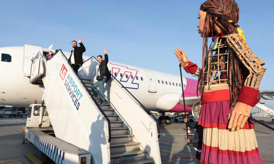 Little Amal puppet by plane