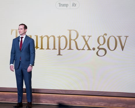 A man stands in front of a backdrop that reads 'TrumpRx.gov'